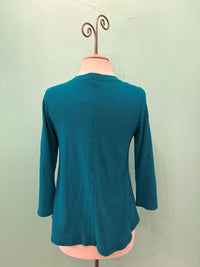 Back view of a teal 3/4 sleeve women's top displayed on a mannequin