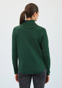 Back view of a woman wearing a green pullover top with long sleeves