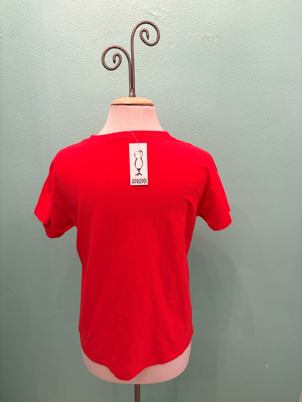 Back view of Classic Red Tee with Apropos tag on mannequin
