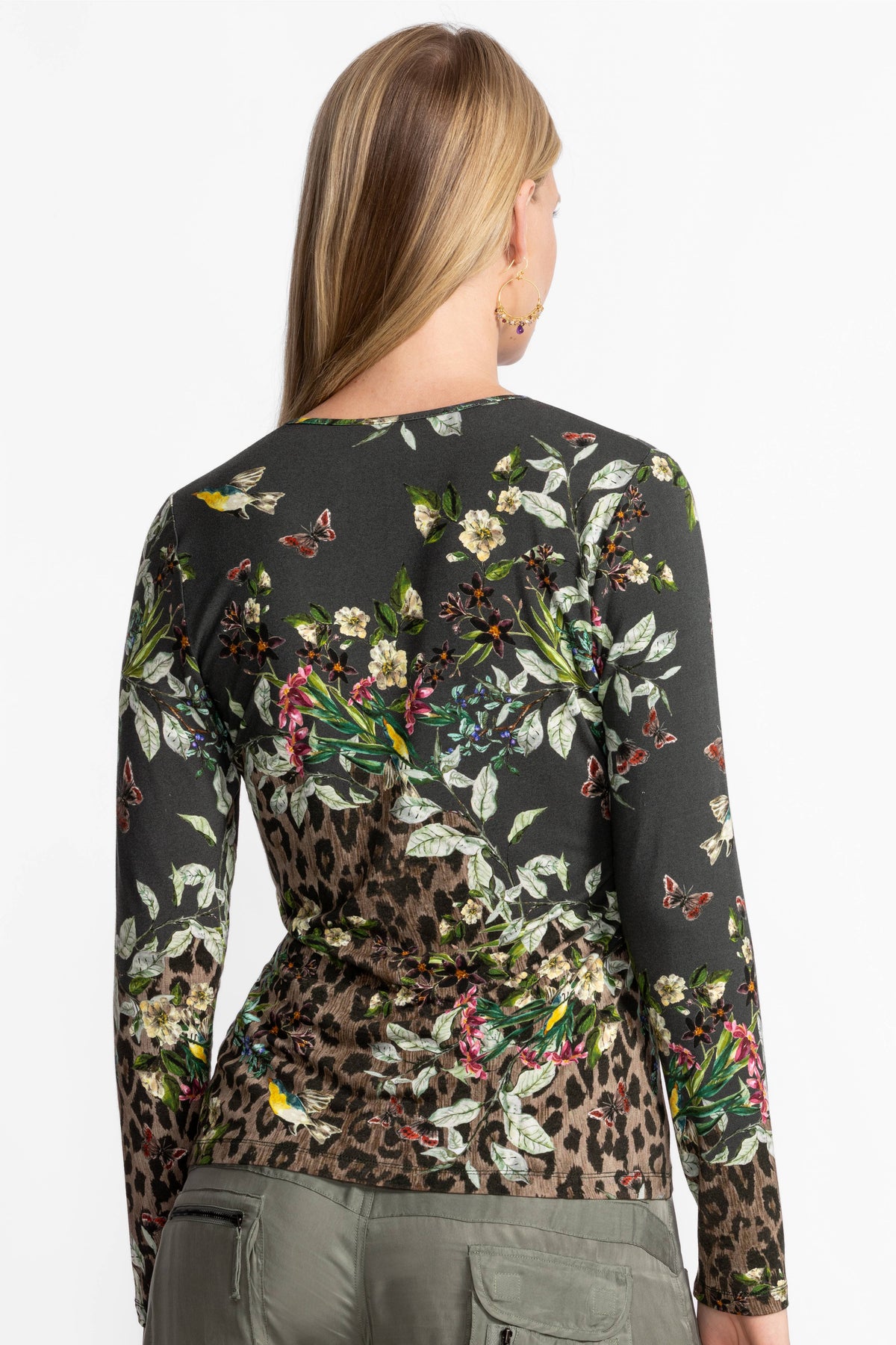 Back view of floral and animal print long sleeve keyhole top