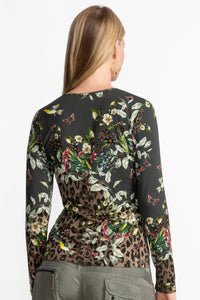 Back view of floral and animal print long sleeve keyhole top