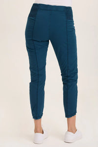 Back view of teal utility capri pants with stretch waistband and cropped legs