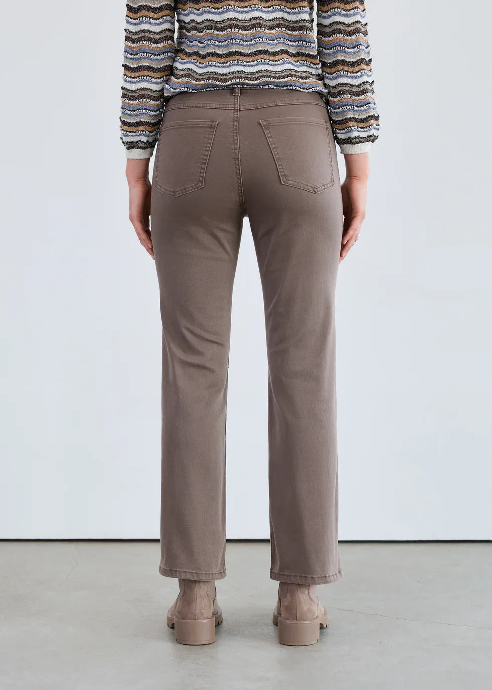 Back view of taupe straight-leg mid-rise jeans with functional pockets