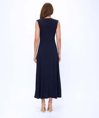 Back view of navy sleeveless maxi dress worn by woman with heels