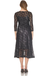 Back view of a woman wearing a black lace midi dress with sheer sleeves