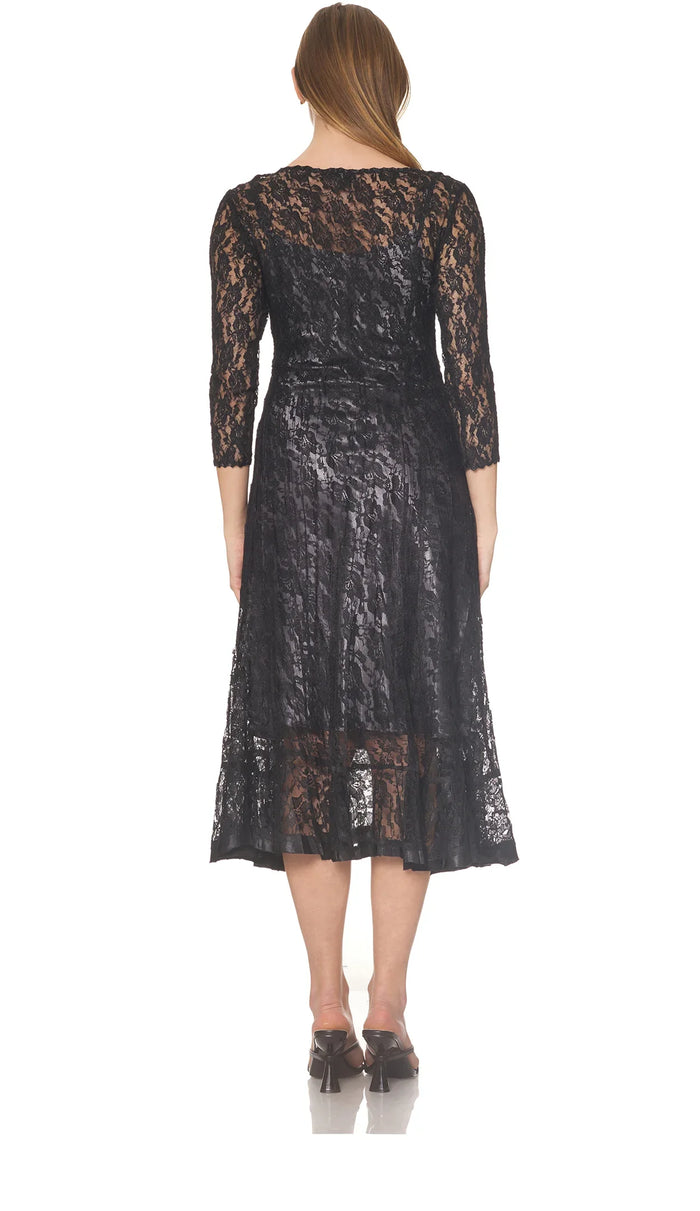 Back view of a woman wearing a black lace midi dress with sheer sleeves