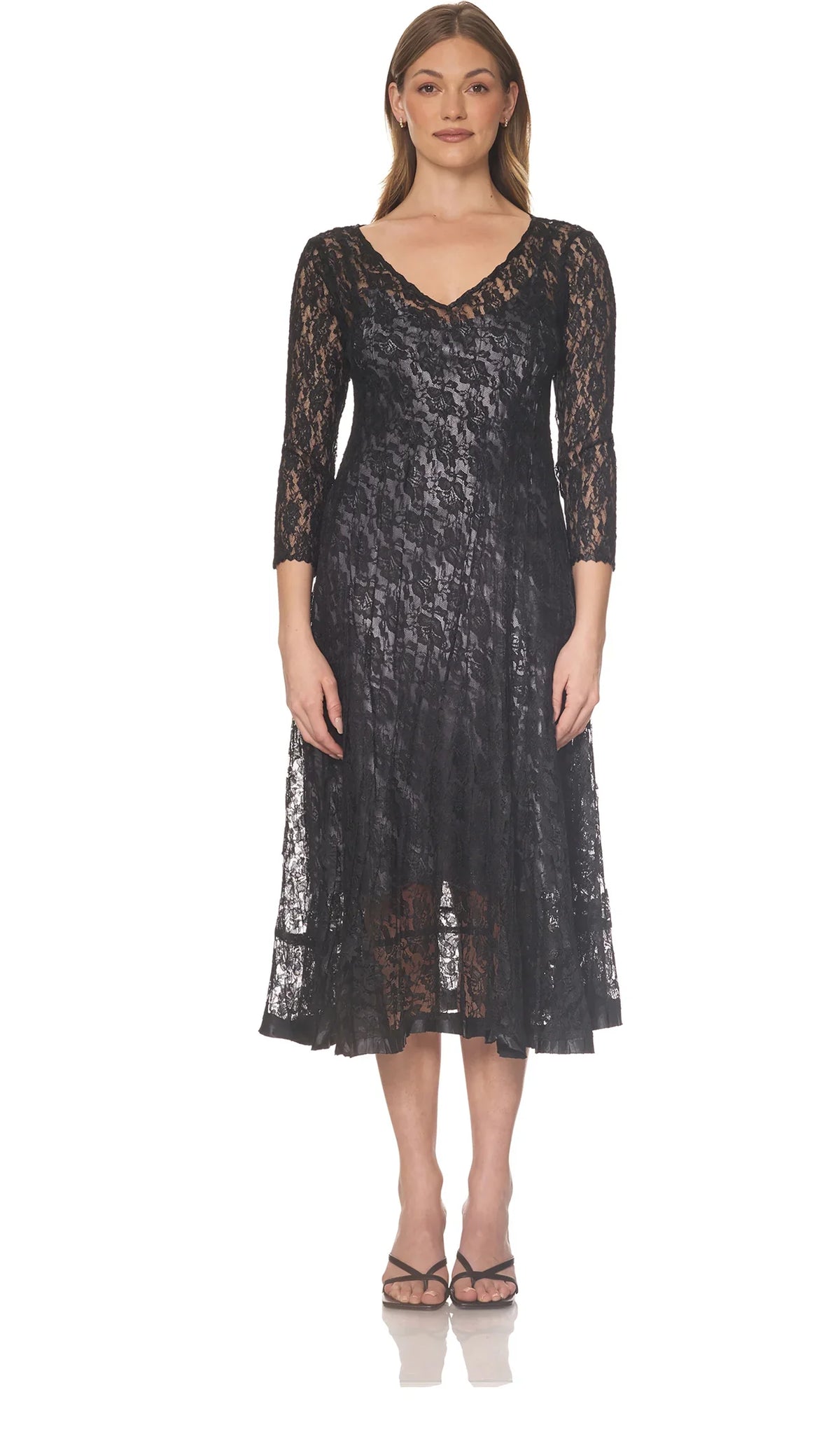 Front view of a woman showcasing a black lace midi dress with V-neckline
