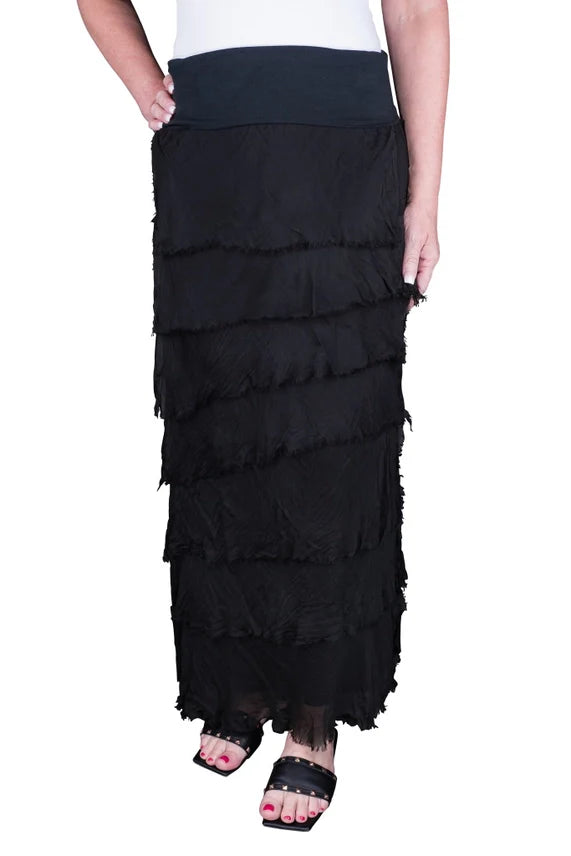 Woman wearing black layered boho maxi skirt with frayed tiered design