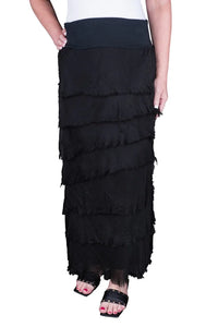 Woman wearing black layered boho maxi skirt with frayed tiered design