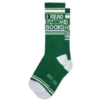 Pair of green 'I Read Banned Books' socks laid out on a white background