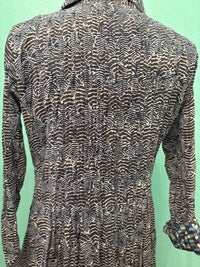 Close up of the back fabric detail with black and white wavy pattern on dress