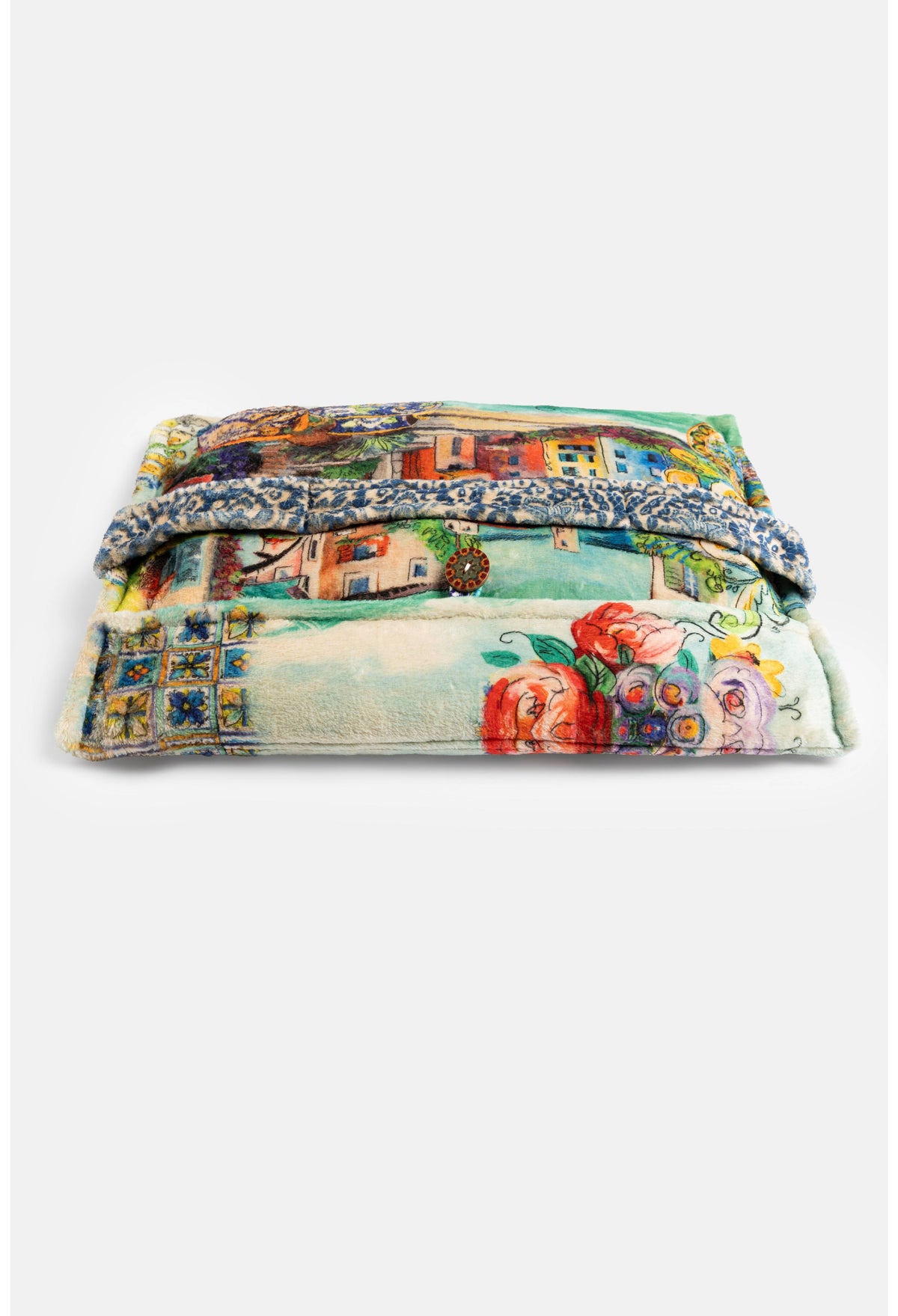 Travel blanket closed with button, Mediterranean landscape print visible