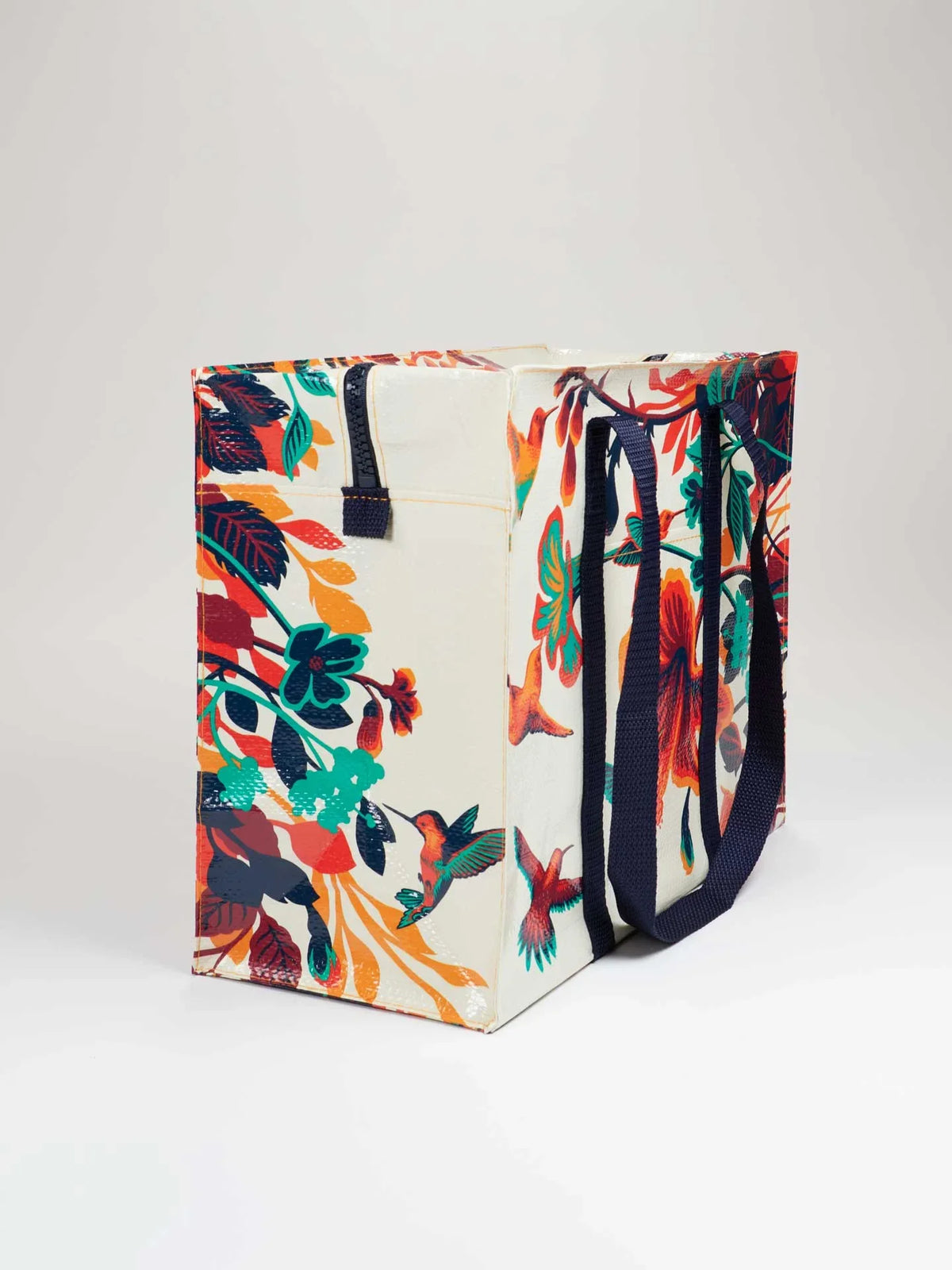 Reusable tote bag decorated with colorful hummingbirds and floral patterns