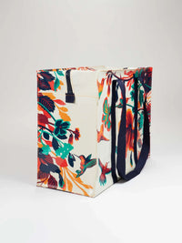 Reusable tote bag decorated with colorful hummingbirds and floral patterns