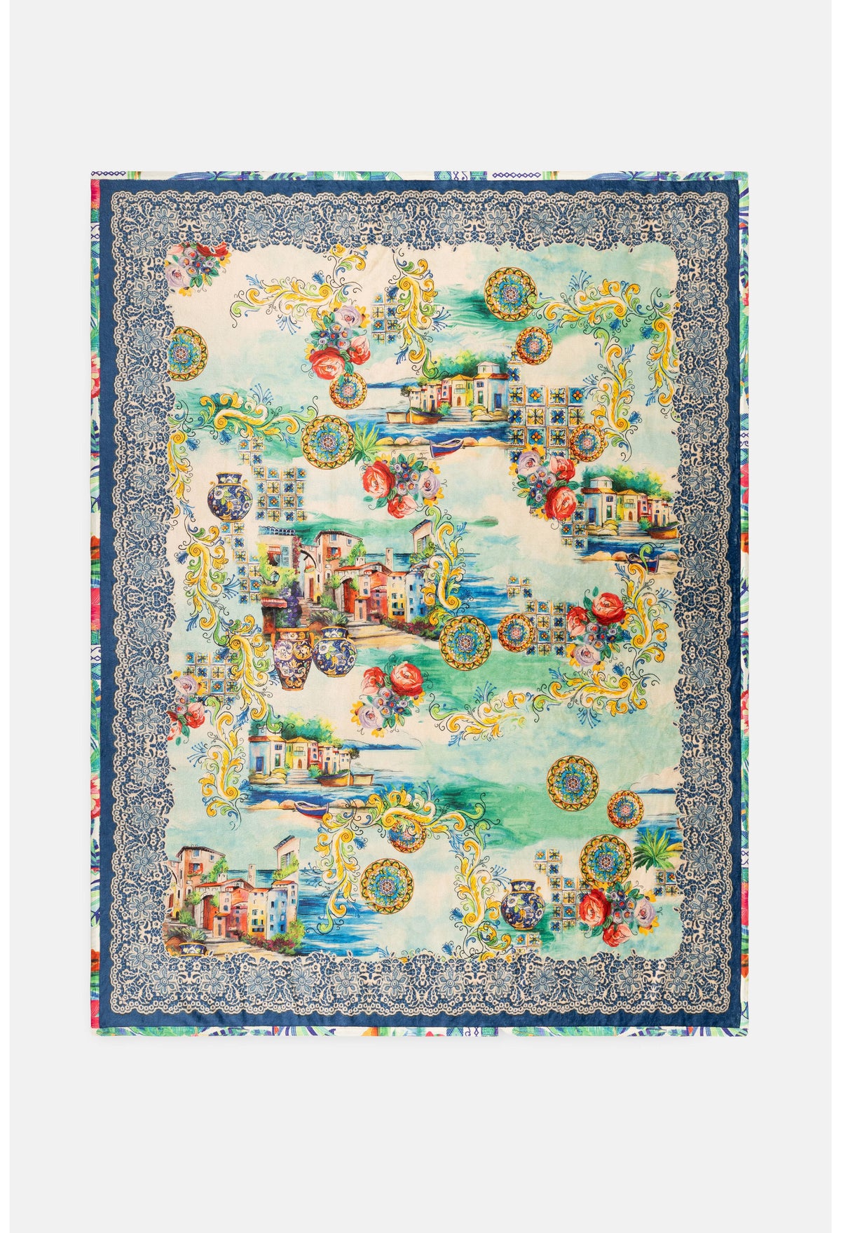Close-up of colorful button and village details on travel blanket