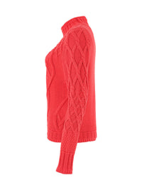 Side view of coral cable knit mock neck sweater on white background