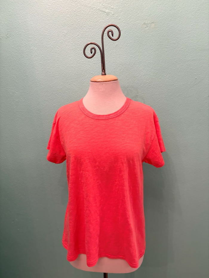 Front view of a coral pink short sleeve women's t-shirt displayed on mannequin