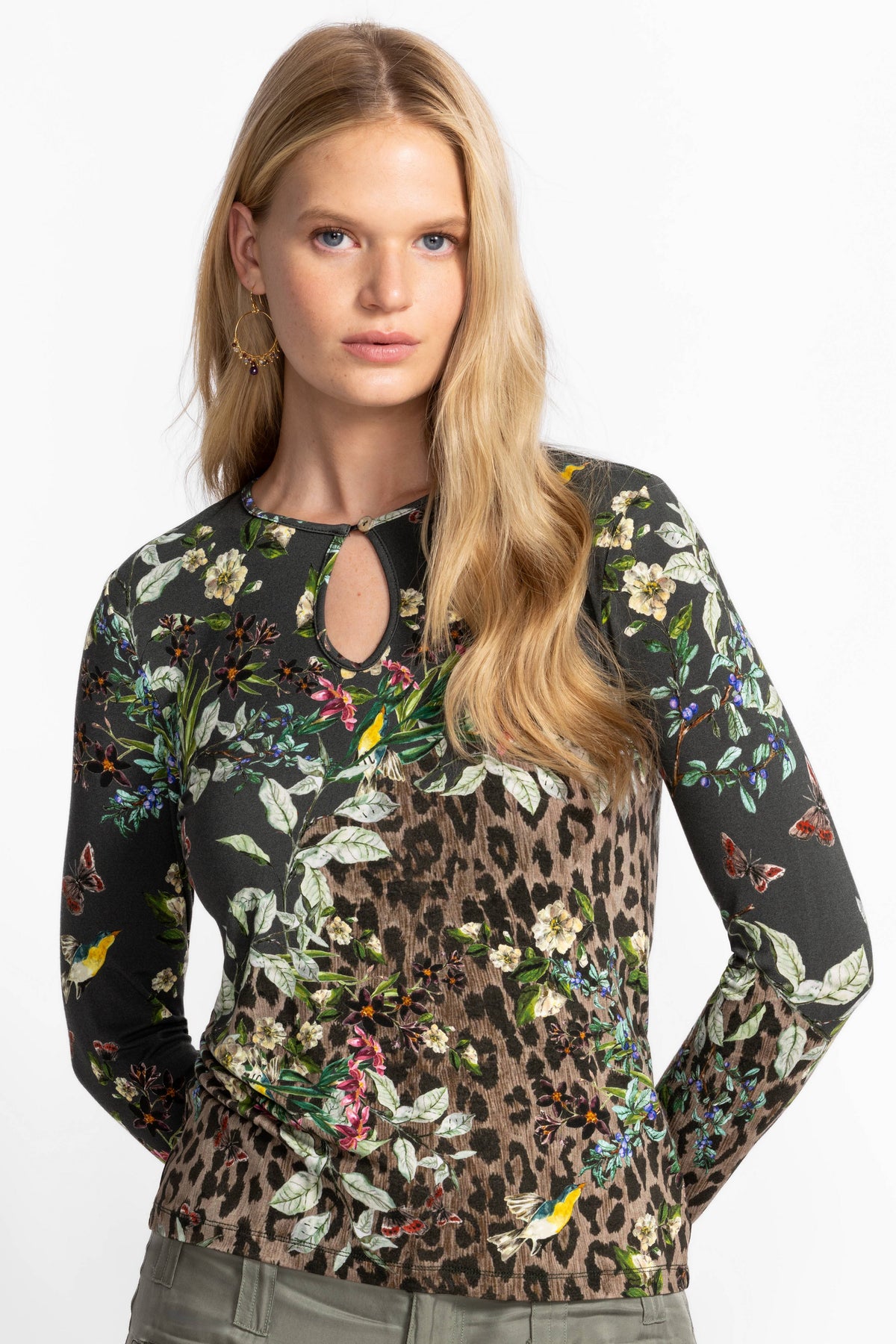 Close-up of floral and animal print keyhole top on model