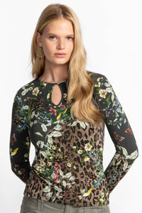 Close-up of floral and animal print keyhole top on model