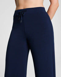 Front side detail of navy wide-leg lounge pants with drawstring waist