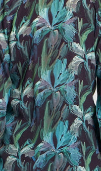Detailed view of blue and green brushstroke floral fabric pattern