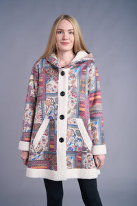 Front view of a woman modeling a boho patchwork sherpa-lined hooded jacket