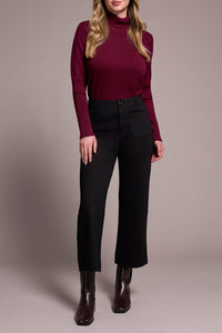Front view of wide-leg black dress pants styled with ankle boots