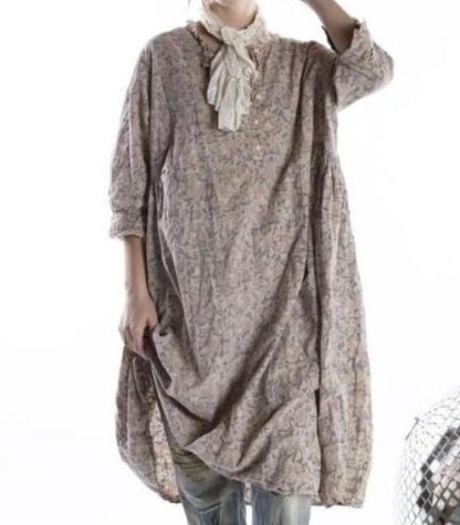 Front view of a vintage floral boho tunic dress paired with a white scarf