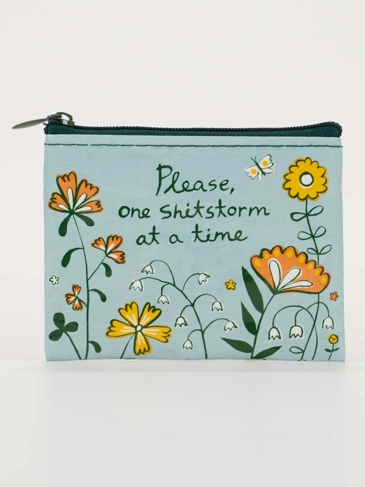 Light blue zippered pouch with whimsical orange and yellow flowers and the text 'Please, one shitstorm at a time'