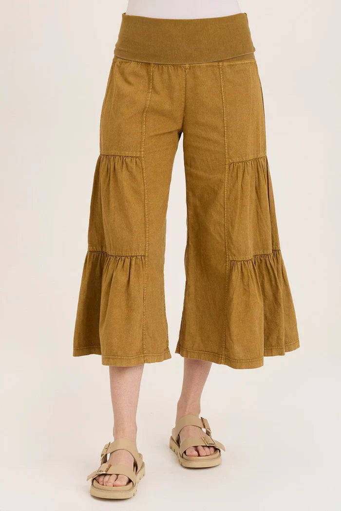 Front view of golden wide leg tiered pants for women