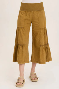 Front view of golden wide leg tiered pants for women