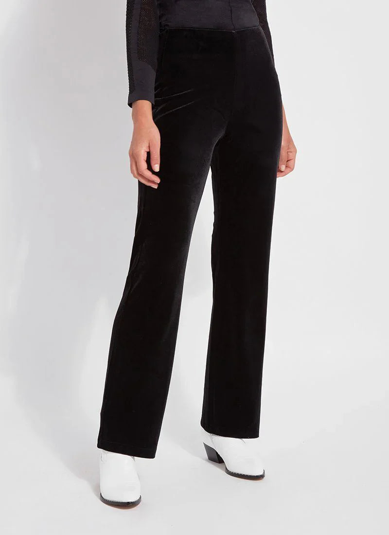 Front angle showing the silhouette of black velvet high-waisted pants