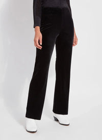 Front angle showing the silhouette of black velvet high-waisted pants