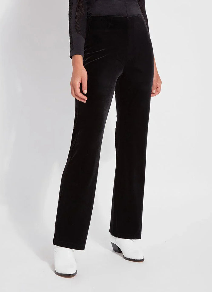 Front angle showing the silhouette of black velvet high-waisted pants