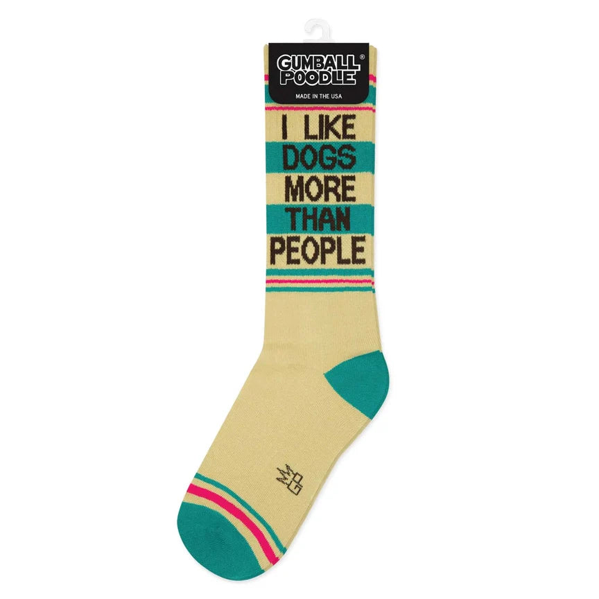 Laid flat, cream socks with teal and pink stripes, and bold 'I Like Dogs More Than People' lettering