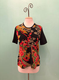Front view of black Japanese kimono tee featuring red, gold, and green floral designs