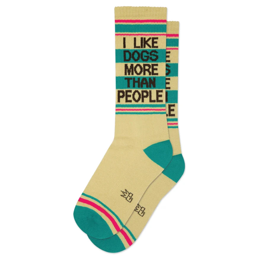 Laid flat, cream socks with teal and pink stripes, and bold 'I Like Dogs More Than People' lettering