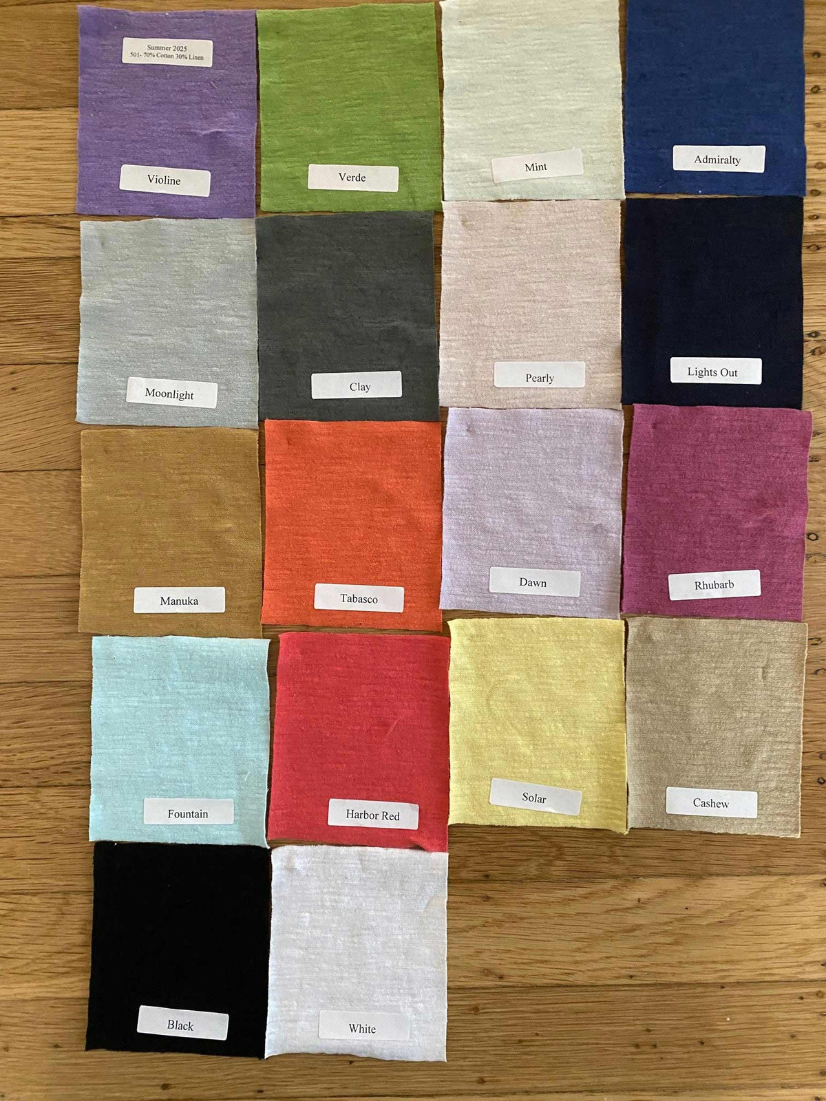 Sixteen color fabric swatches for the linen blend tee, labeled with color names