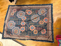 Mandala-patterned travel blanket with geometric and boho accents laid flat