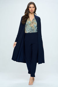 Model wearing navy longline cardigan over chic leopard print top and pants