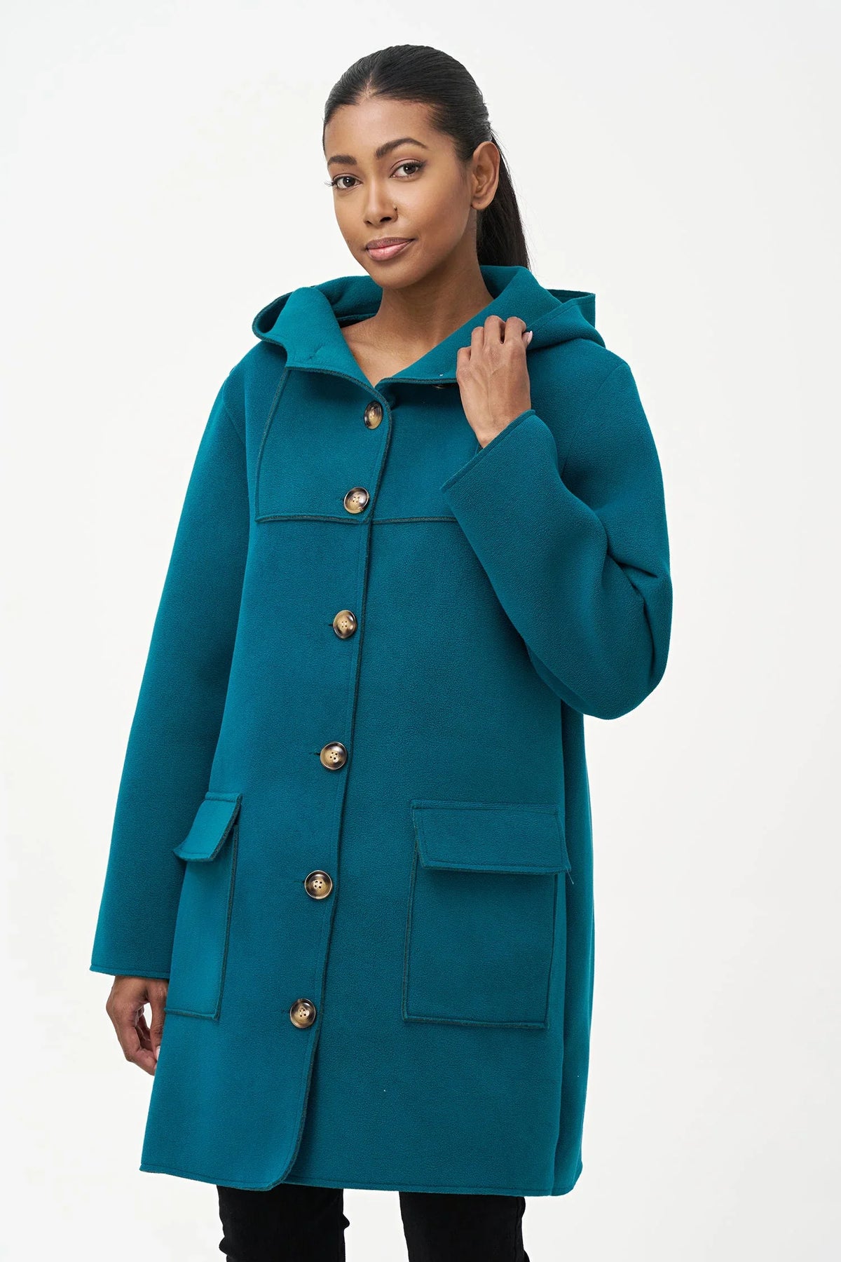 Back view of teal wool hooded coat on model