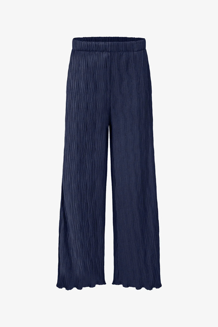 Navy blue wave-textured wide leg pants with elastic waistband and flowy hem