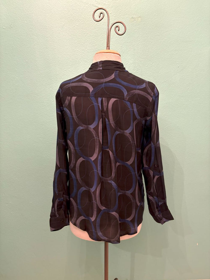 Back view of navy blouse with abstract loop pattern on mannequin