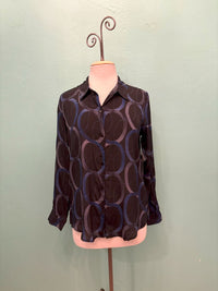 Front view of navy blouse with large blue and purple loop design