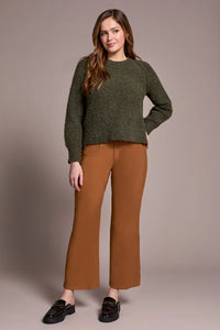 Front view of a woman in an olive green crewneck sweater with relaxed fit