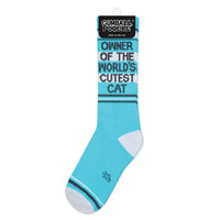 Blue cat owner socks in retail packaging with Gumball Poodle branding