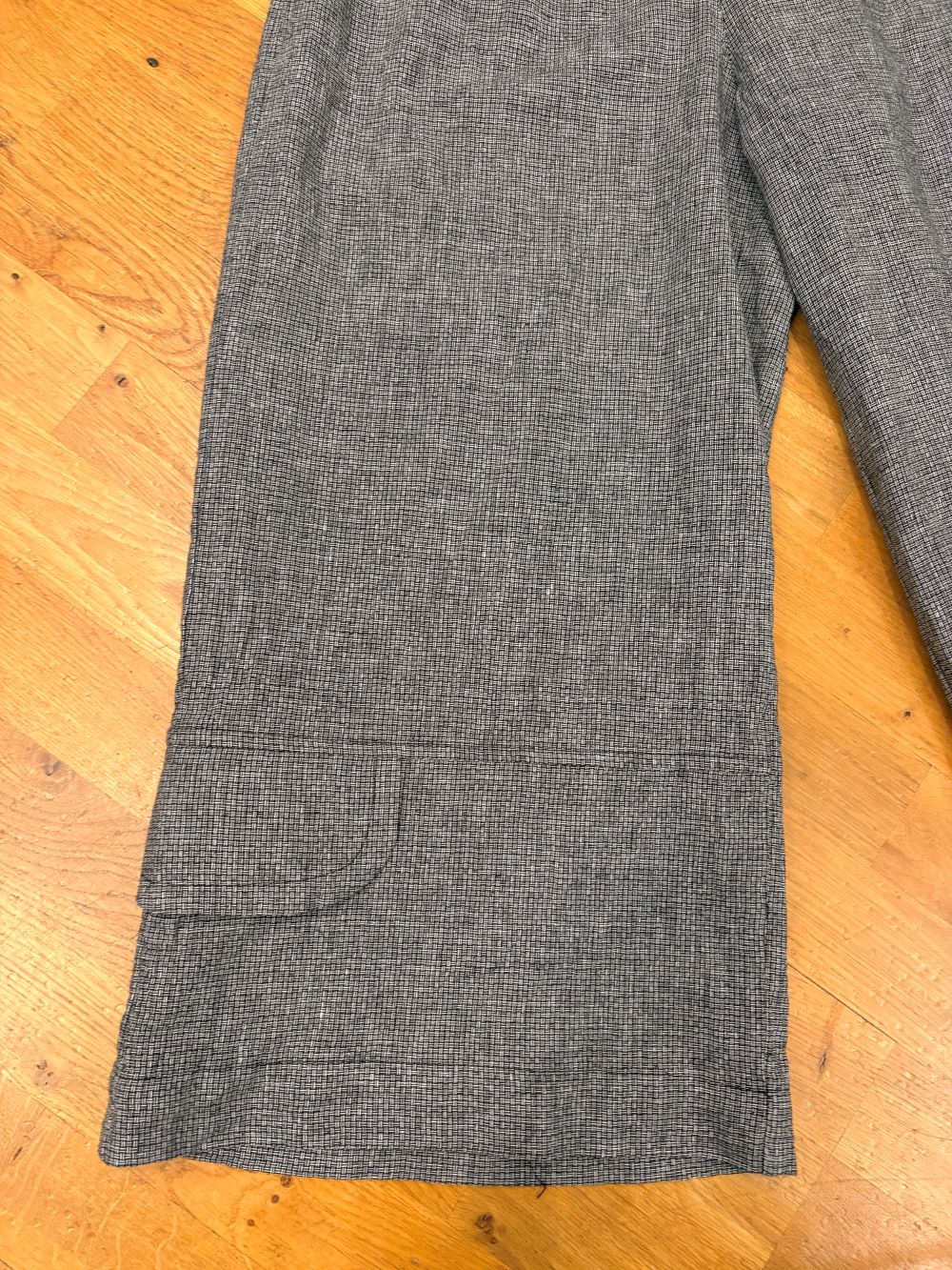 Close-up of pocket detail on heather grey wide leg linen pants