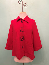 Front view of red textured jacket with black square buttons and front pockets