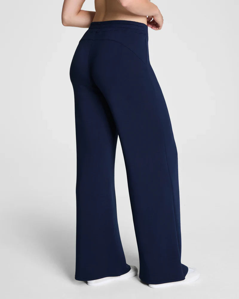 Back view of navy wide-leg lounge pants showcasing relaxed fit