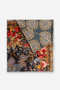 Corner fold showing reversible velvet throw with floral and medallion patterns